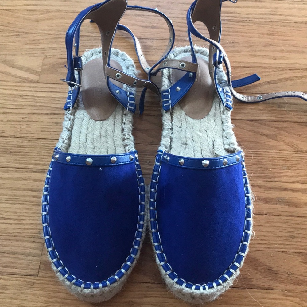Royal blue Sandals with strips around ankles.
